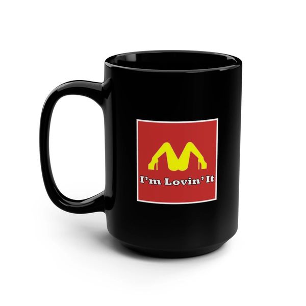Black mug with a parody McDonald's logo and slogan.