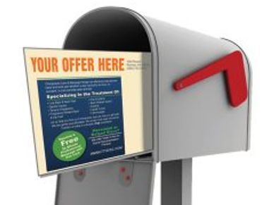 Postcard mailers shown in a mailbox
