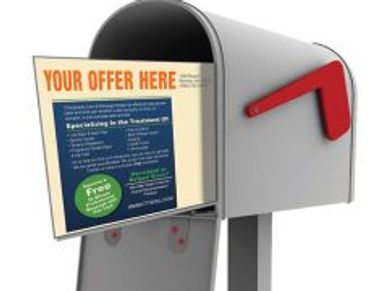 Postcard mailers shown in a mailbox