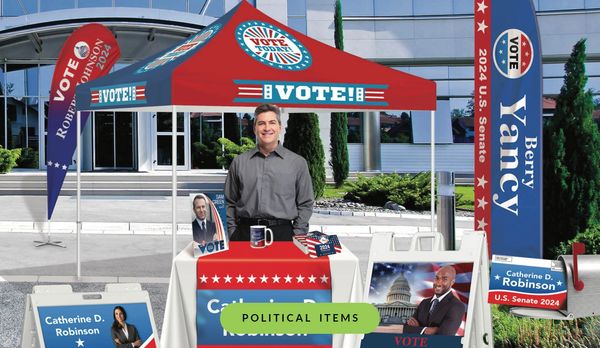 Person at political campaign event with printed items: sign, flag, banner and tablecover
