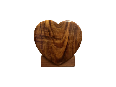 koa heart-shaped urn on a stand
