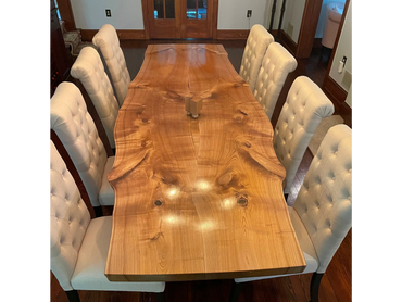 Large live edge dining room table with exquisite figure. Every inch of the surface is covered with c