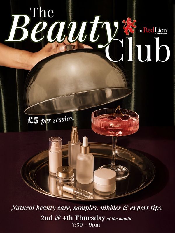The Beauty Club event with natural beauty products and a cocktail.
