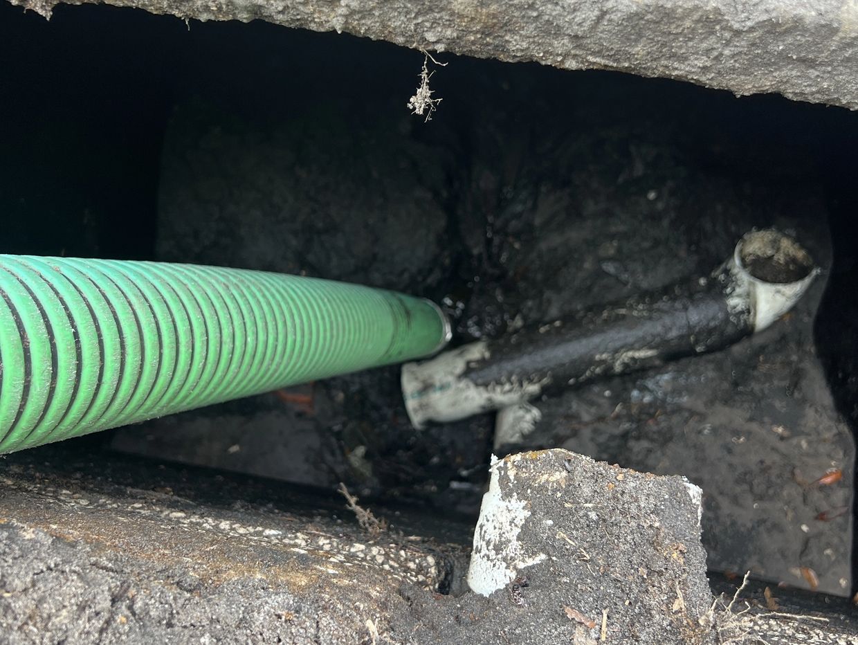 Inspecting a septic tank full of dirt 