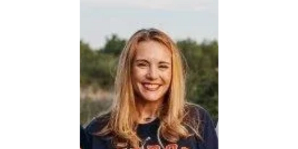 Headshot of a smiling mother representing trusted family insurance coverage.