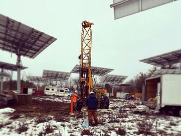 Performing geotechnical and environmental drilling studies for a solar farm project in the winter.