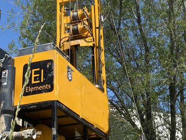 Our drill rig with our logo on the toolbox This image is for a link showcasing our drilling projects