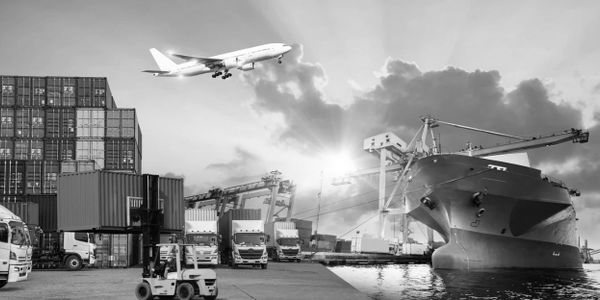 Busy port with cargo ships, trucks, containers, and a plane overhead.