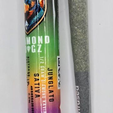 Close-up of a colorful cannabis joint package and a rolled joint.