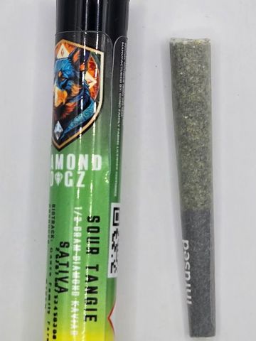 Diamond OGz Sativa pre-roll and joint on a white surface.