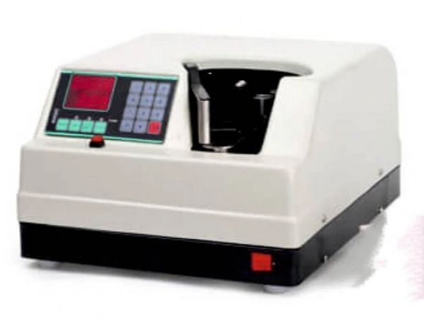 Compact laboratory centrifuge with digital controls and display.