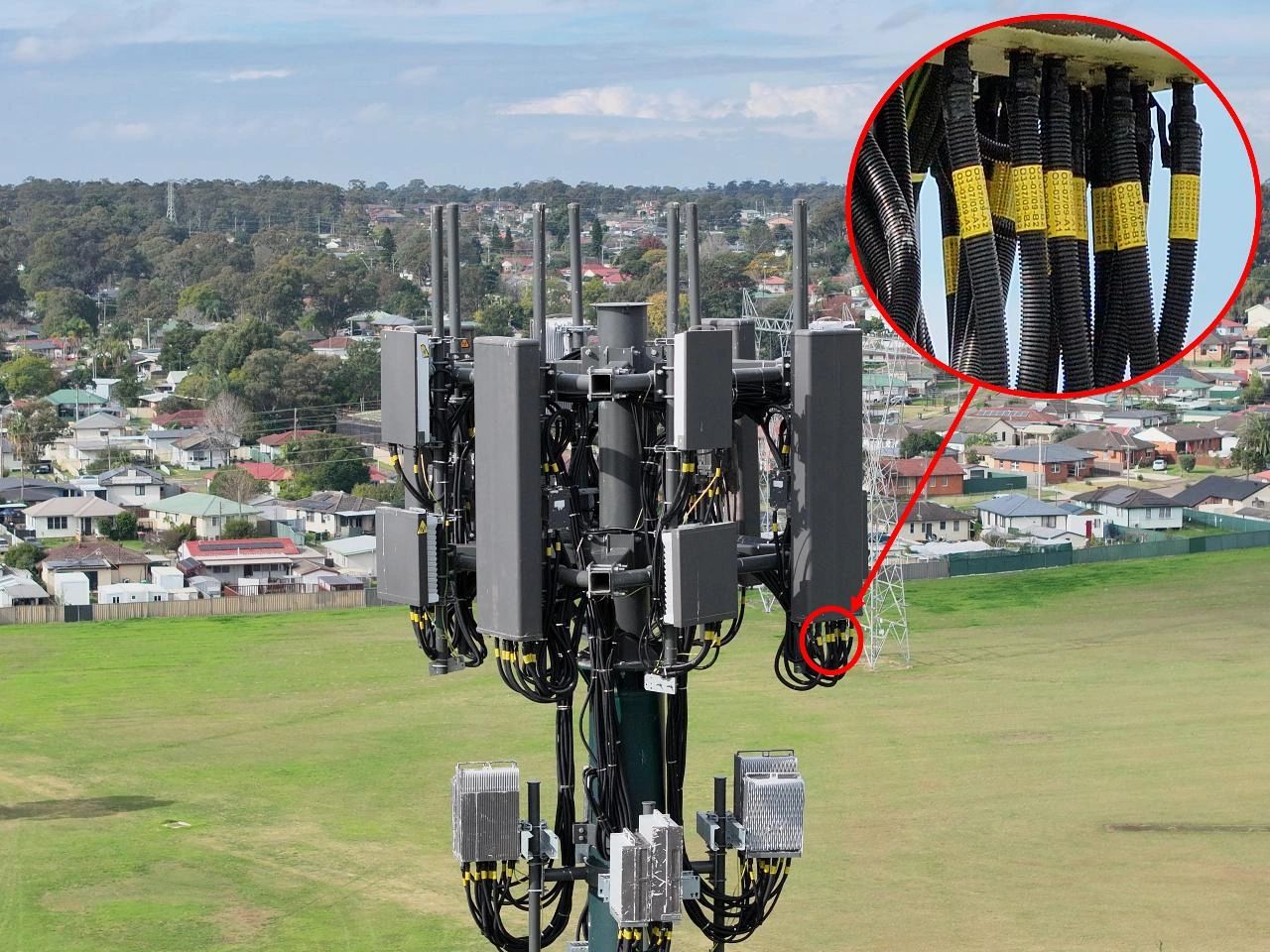 Aerial photo of mobile phone tower with close up of cabling.