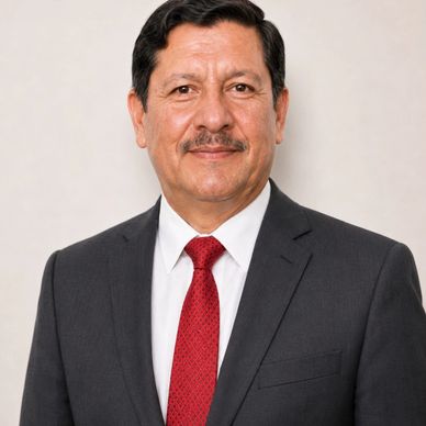 Professional portrait of a man in a suit with a red tie.