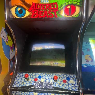 Classic SEGA Altered Beast arcade machine with vibrant artwork and controls.
