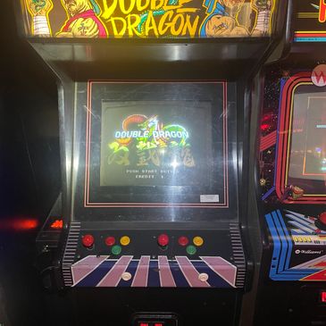 Classic Double Dragon arcade machine with colorful controls.