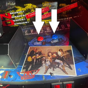 Retro arcade game with rock band photo and start buttons labeled 1 and 2.