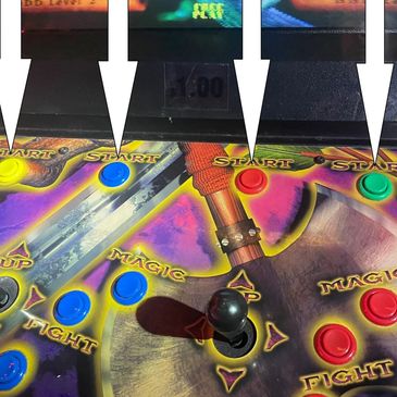 Arcade game control panel with colorful buttons and joystick.