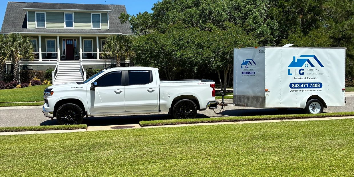 LG Painting + Construction work truck and enclosed trailer at a home painting project in Mount Pleas