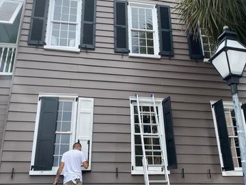 Historic Charleston exterior painting project featuring detailed shutter refinishing, trim painting, and siding restoration by LG Painting + Construction. Our team delivers durable finishes and long-lasting protection designed for Charleston's coastal climate.