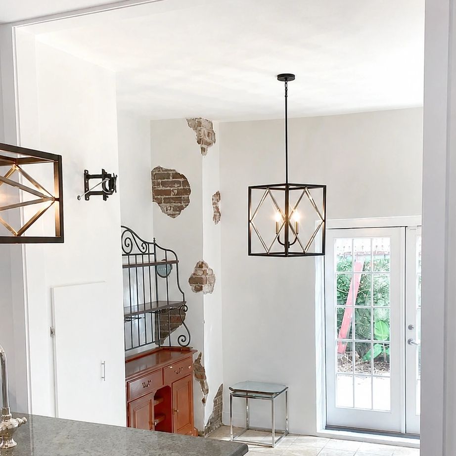 Living space with exposed brick walls and modern lighting fixtures.