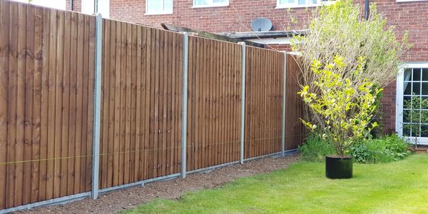 How to slot fence panels into concrete posts concrete