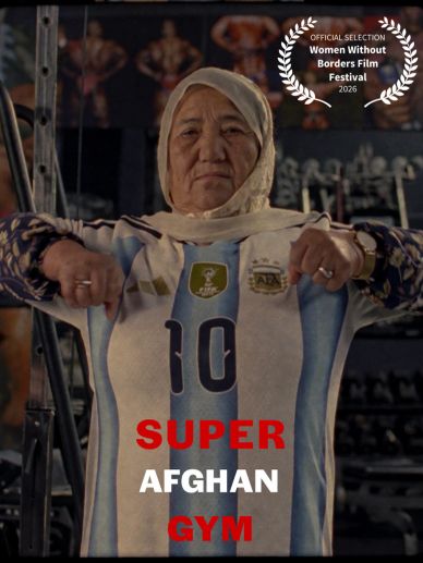 Elderly woman proudly wearing a soccer jersey in a gym setting.