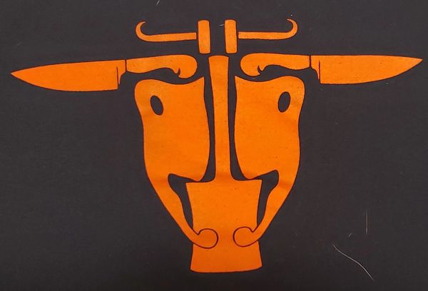 Picture of the shop logo; a cow's skull made out of butchering equipment.