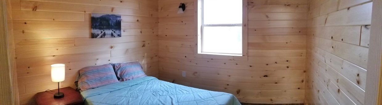 a cabin with a Luxury bed