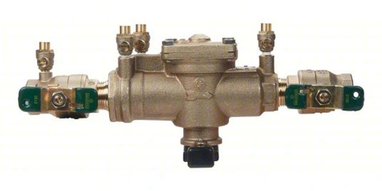 A brass backflow assembly with multiple connectors and shut-off valves.