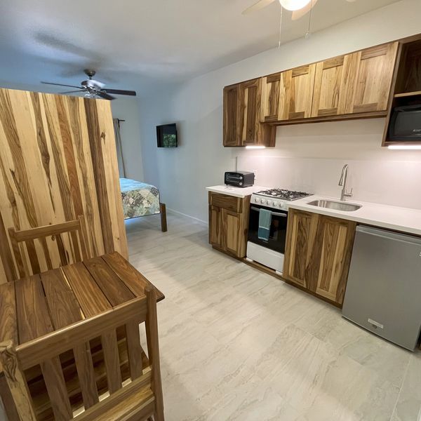 Studio includes full kitchen, dining table, queen bed, private bath with large walk in shower, and p