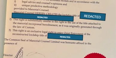 Close-up of a legal document with redacted text and a red seal.