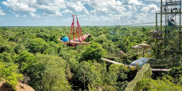 Extreme zipline flight over the Mayan jungle at Selvatica adventure park.