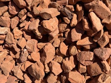 Pile of small reddish-brown rocks.
