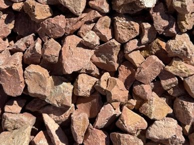 Close-up of reddish rocks piled together.