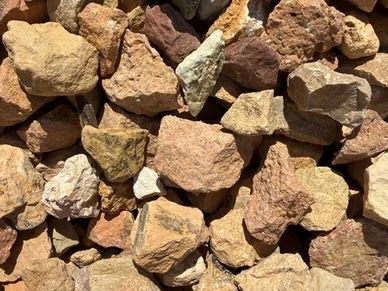 Pile of various brown and beige rocks.