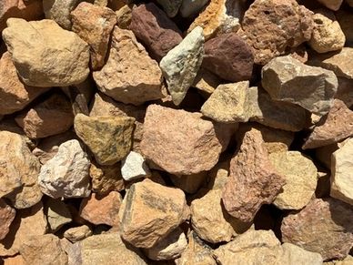Close-up of various brown and beige rocks.