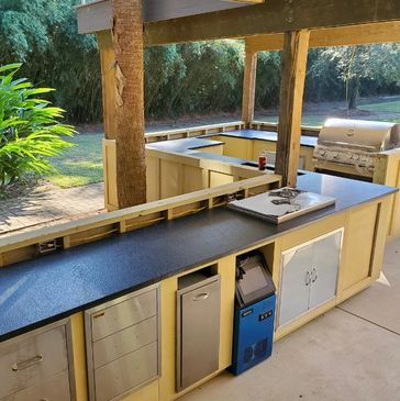Outdoor kitchen with brushed black granite.