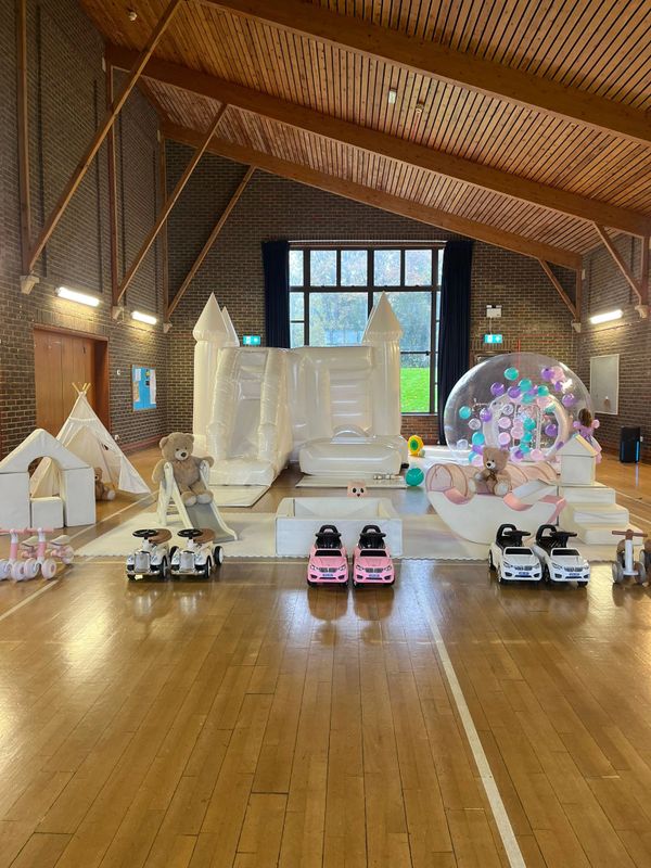 White Bouncy Castle with slide, balloon dome & Soft Play at Woolmer Green Village Hall Hertfordshire