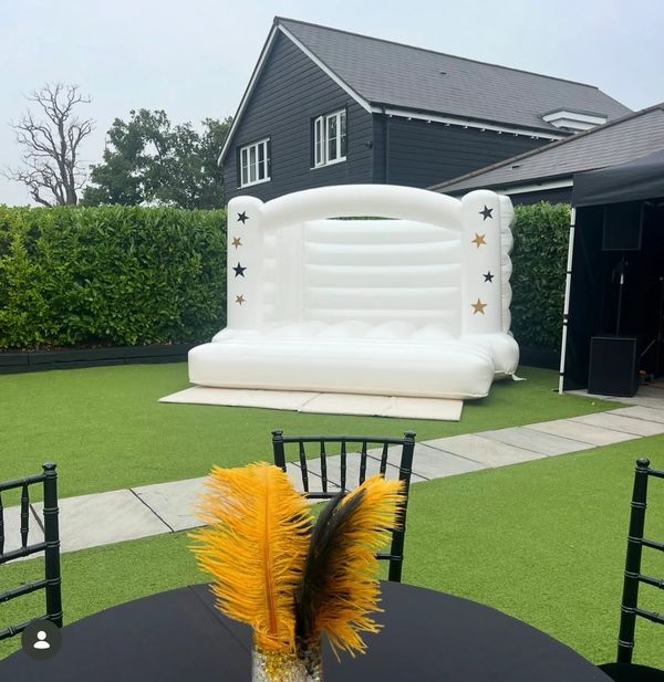 Large, white, luxury bouncy castle set up in Knebworth, Hertfordshire