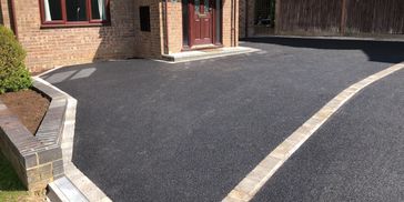 New tarmac driveway 
Tarmac with block edging 
Tarmac