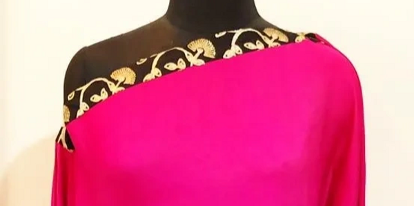 Pink crushed satin off shoulder cape with black & gold detail