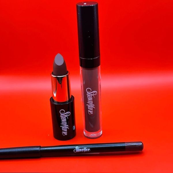 Three dark-toned lip products from SteamWave against a red background.