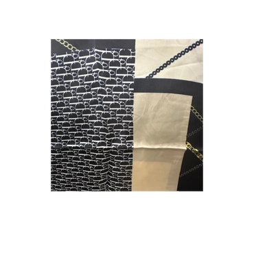 Crafted from premium silk, the DD Printed Scarf blends modern sophistication with timeless style. 