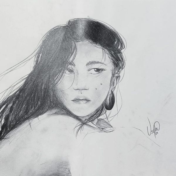 Pencil sketch of a woman with flowing hair and a contemplative gaze.