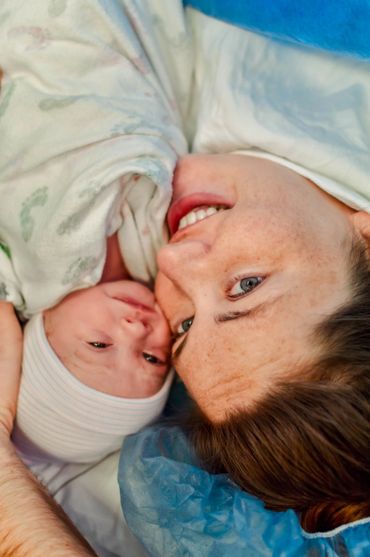 Baby and mommy during birth photography