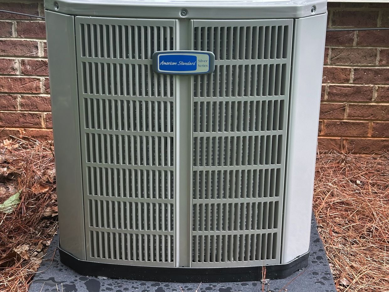 American Standard Silver Series air conditioning unit outside a house.