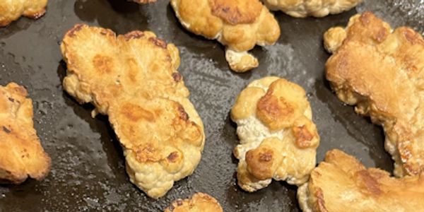 Lion's Mane mushrooms cooking in a pan