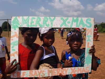 Children wishing everyone a merry christmas