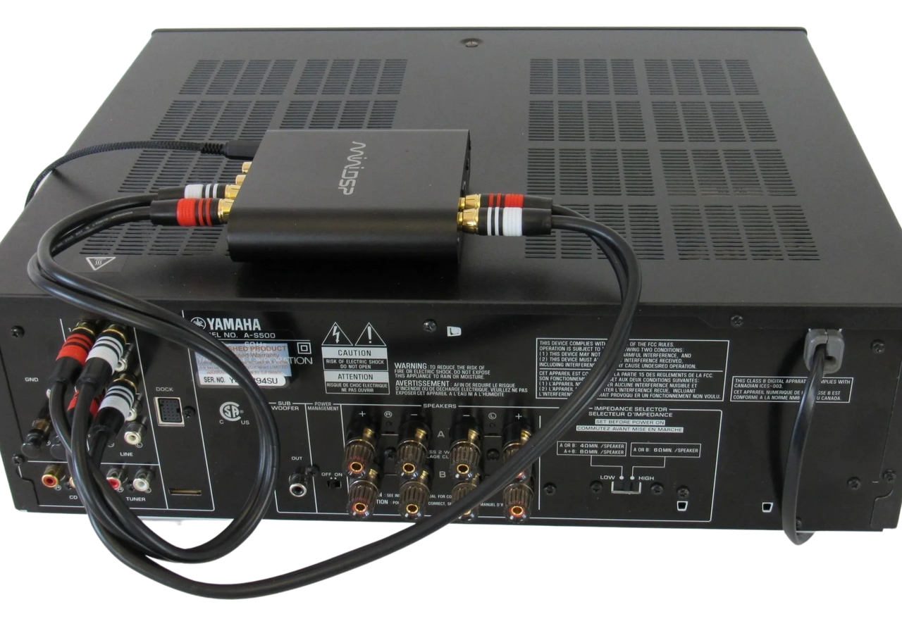 A sleek and compact EQ901 Elite connected to an integrated amplifier