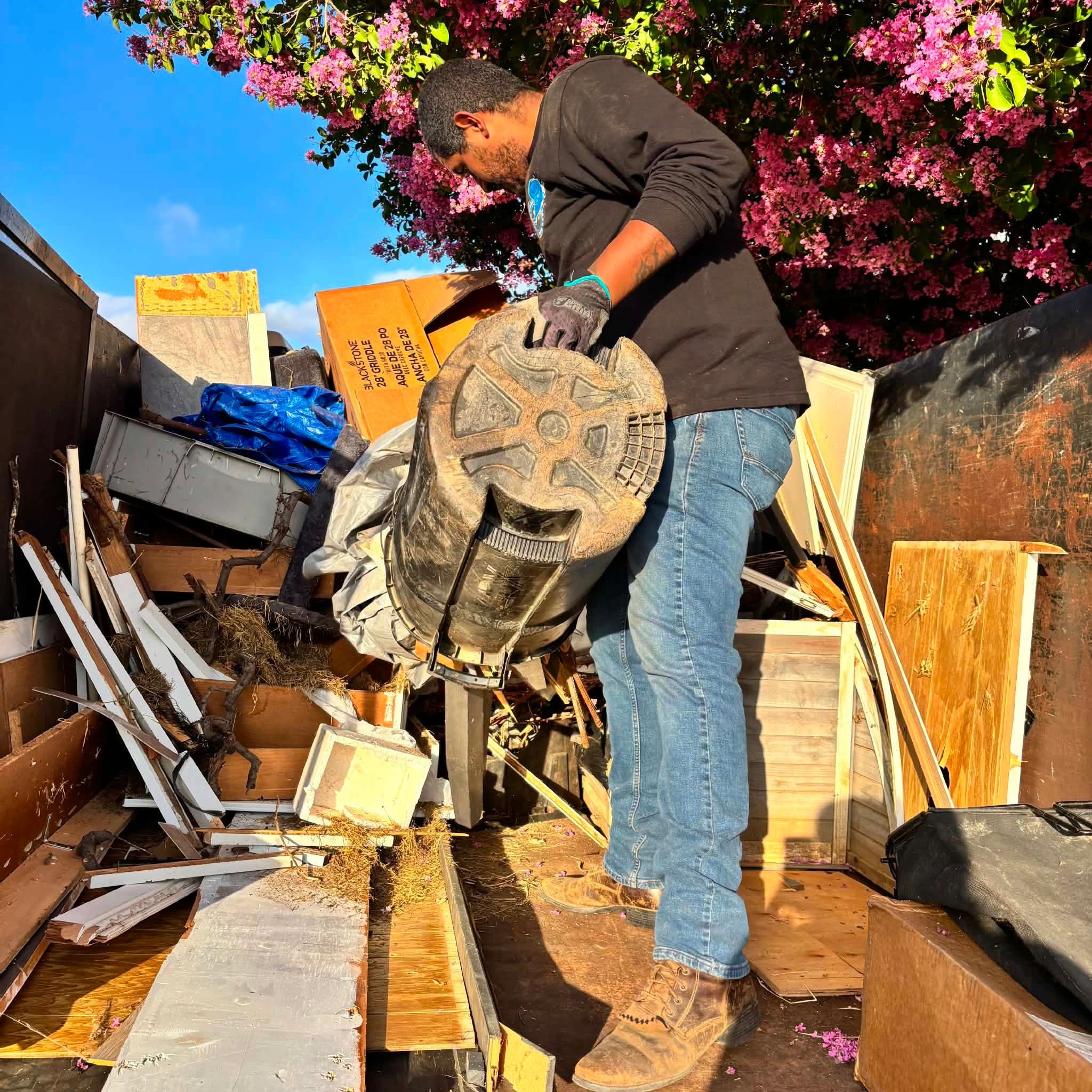 Quick Call Junk Haul loading large dump trailer of household furniture, wood & debris Lake Elsinore